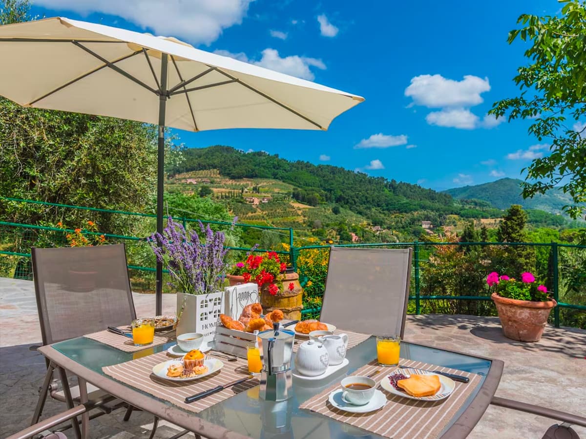 Breakfast laid on a private terrace with a view over the Lucca hills