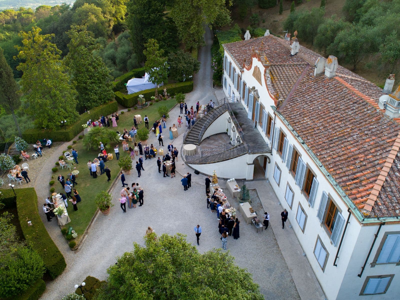 A wedding reception on the villa terrace at dusk
